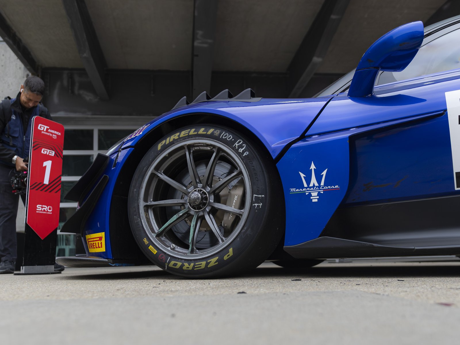Close-up of the Maserati GT2 front wheel and Pirelli tire in the Indianapolis pit lane