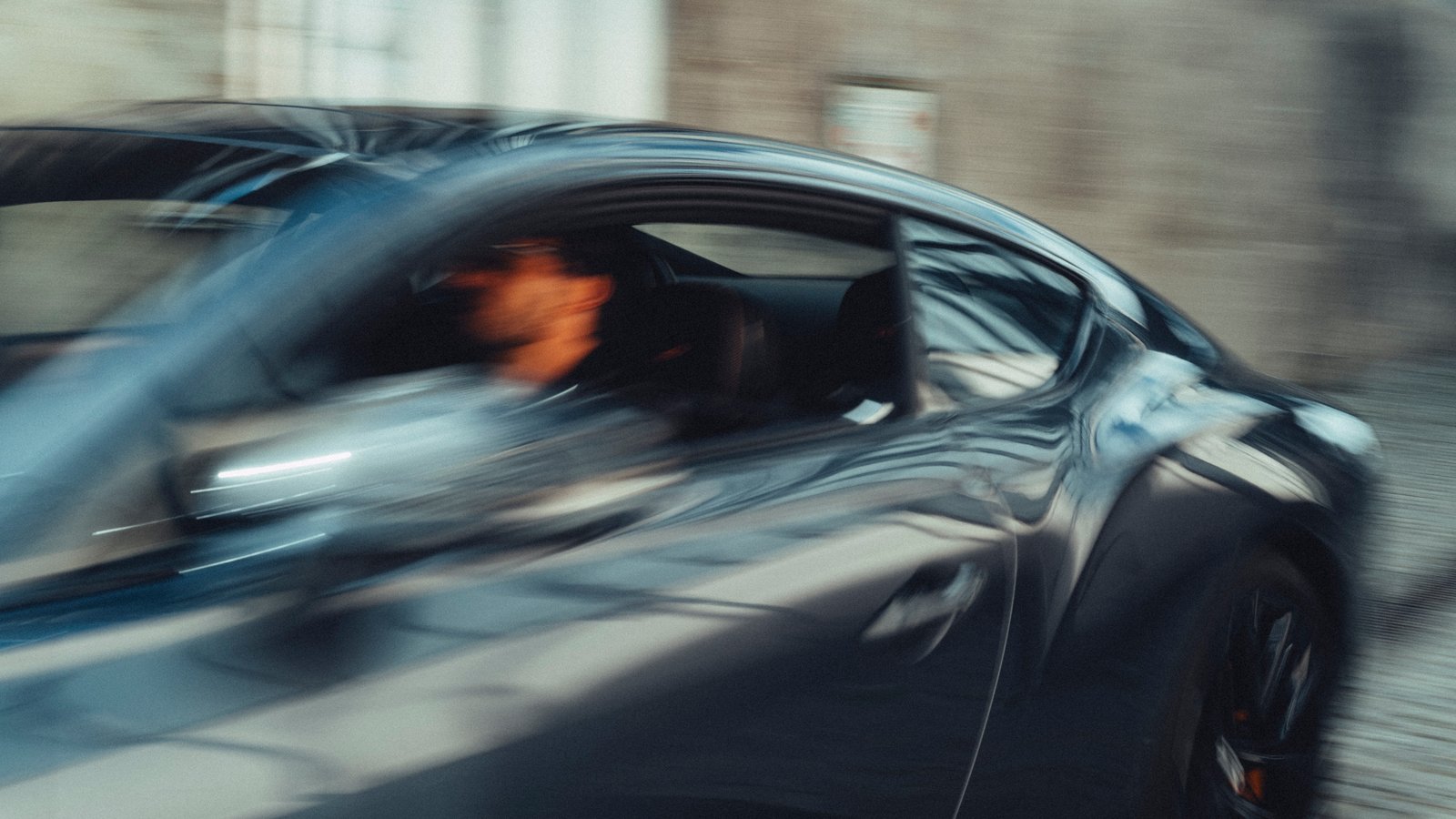 Bentley Continental GT Speed driving through a parking garage, motion blur