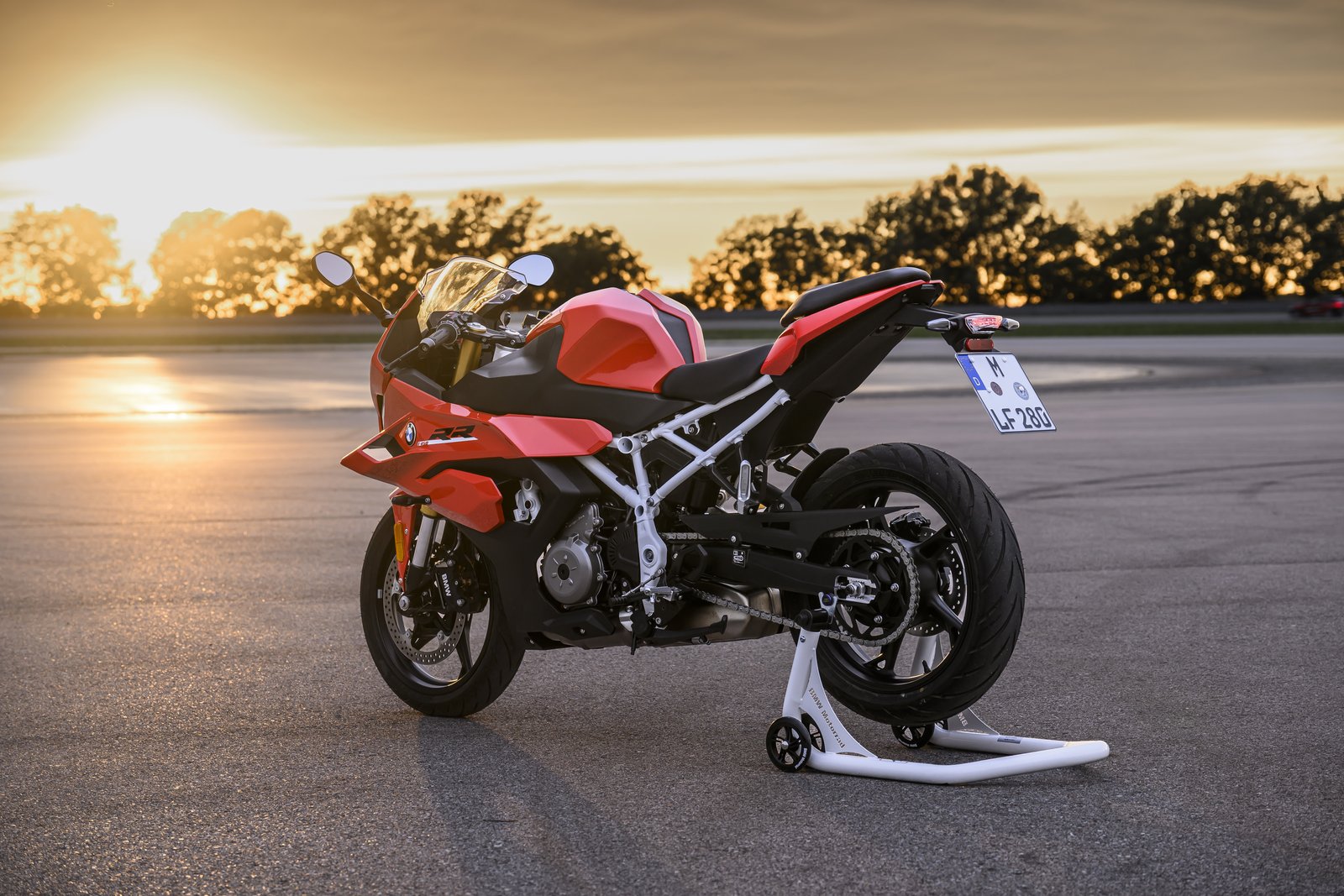 BMW F 450 RR on a paddock stand, rear three-quarter view at sunset