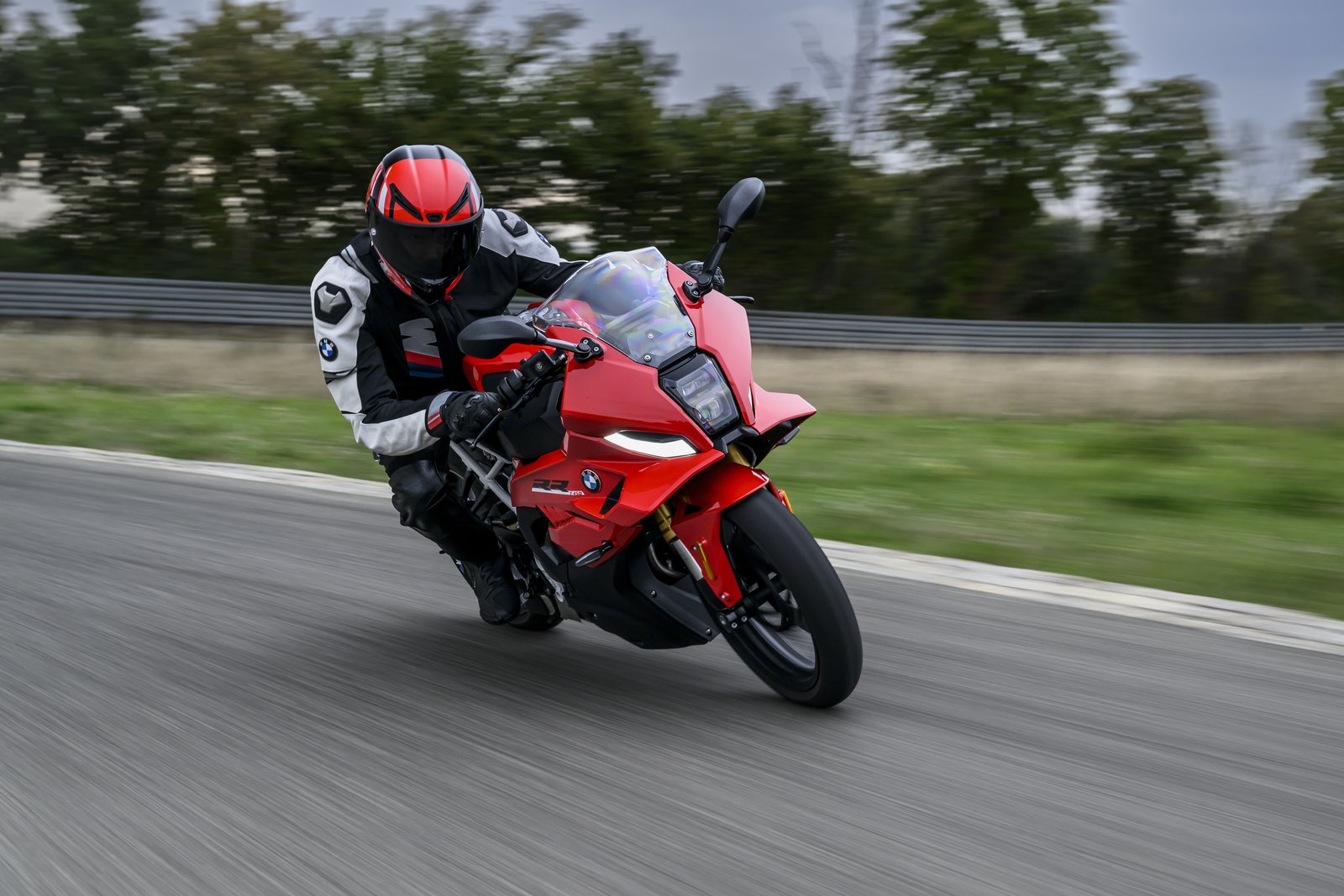 Rider cornering the BMW F 450 RR on a racetrack