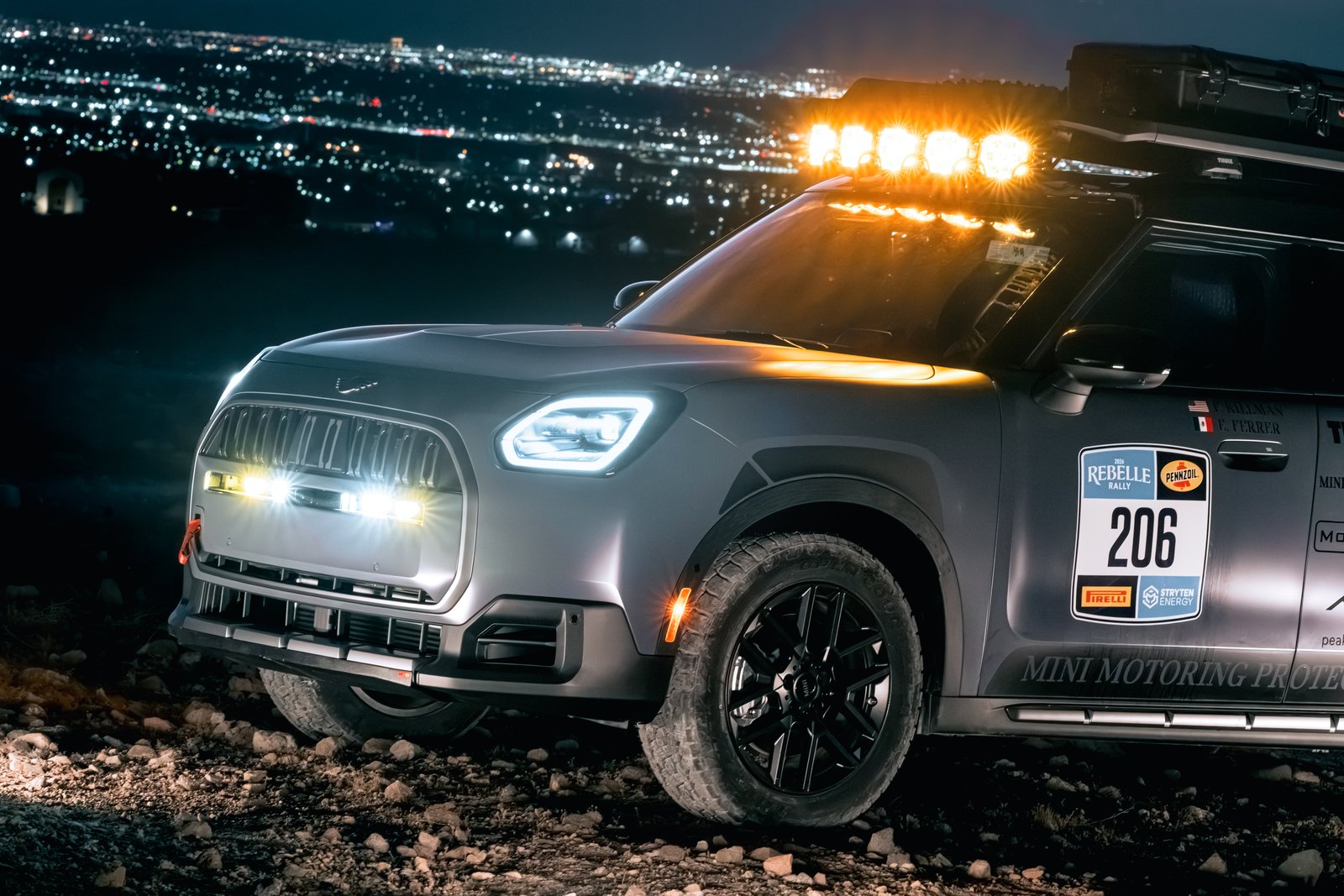 Front of the MINI Countryman rally car with auxiliary roof and grille lights