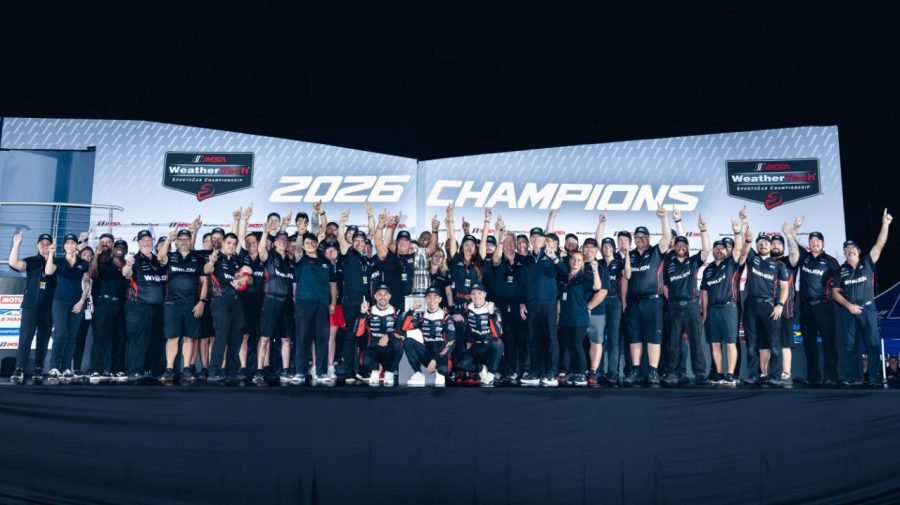 Cadillac Whelen team celebrating 2026 IMSA GTP championship on stage
