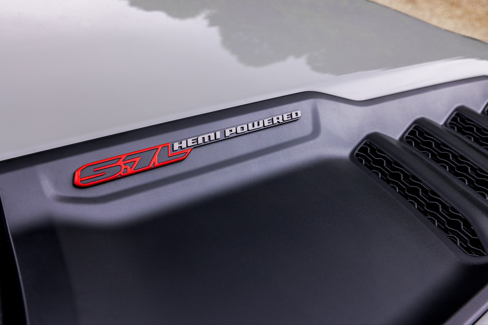 5.7 HEMI badge on the hood of a 2027 Ram 1500 Rumble Bee