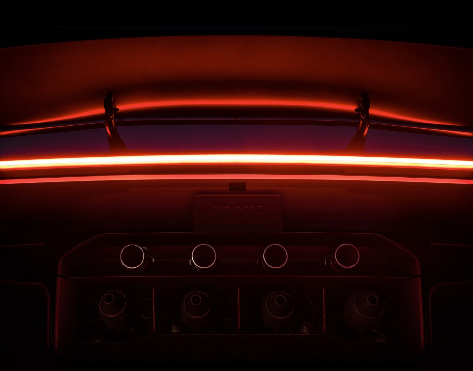 Close-up of the Tesla Roadster’s four rear thruster nozzles and active wing
