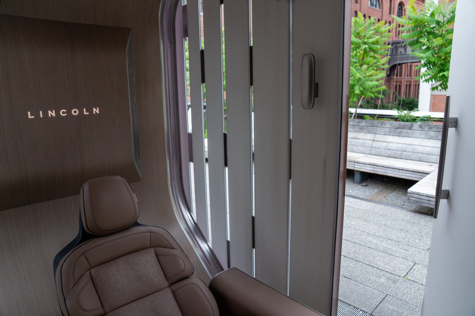 Navigator massage seat in brown leather inside the Lincoln pod