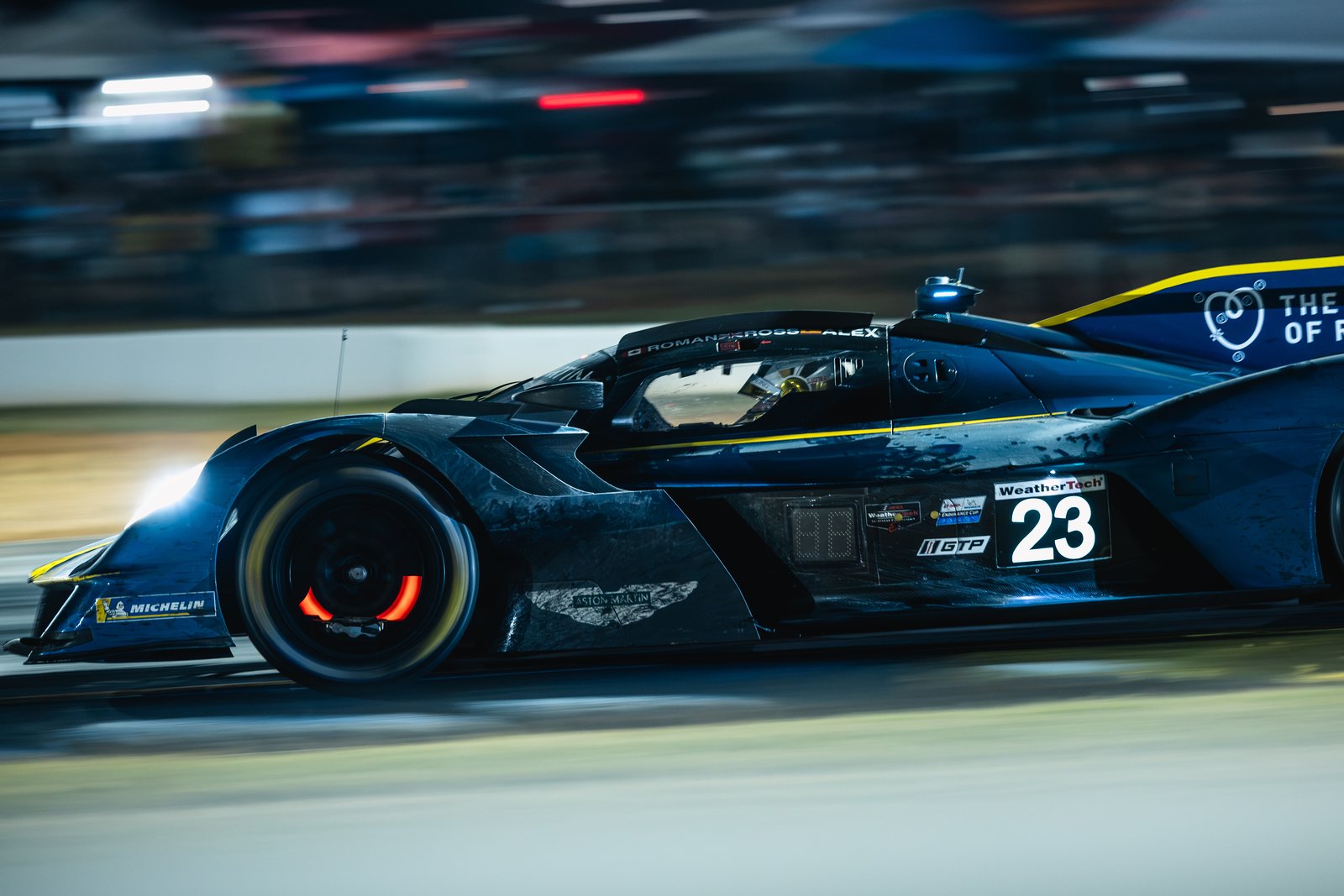 Aston Martin Valkyrie at night with glowing brakes