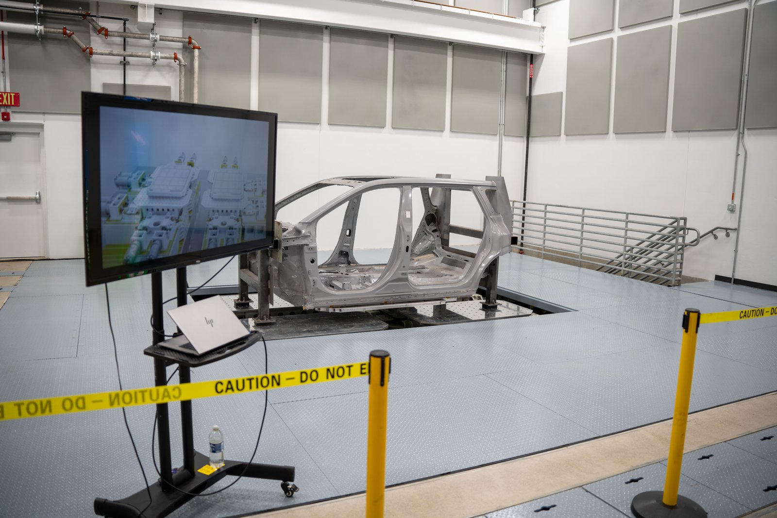 Vehicle body shell mounted on a vibration test rig at Toyota's battery center