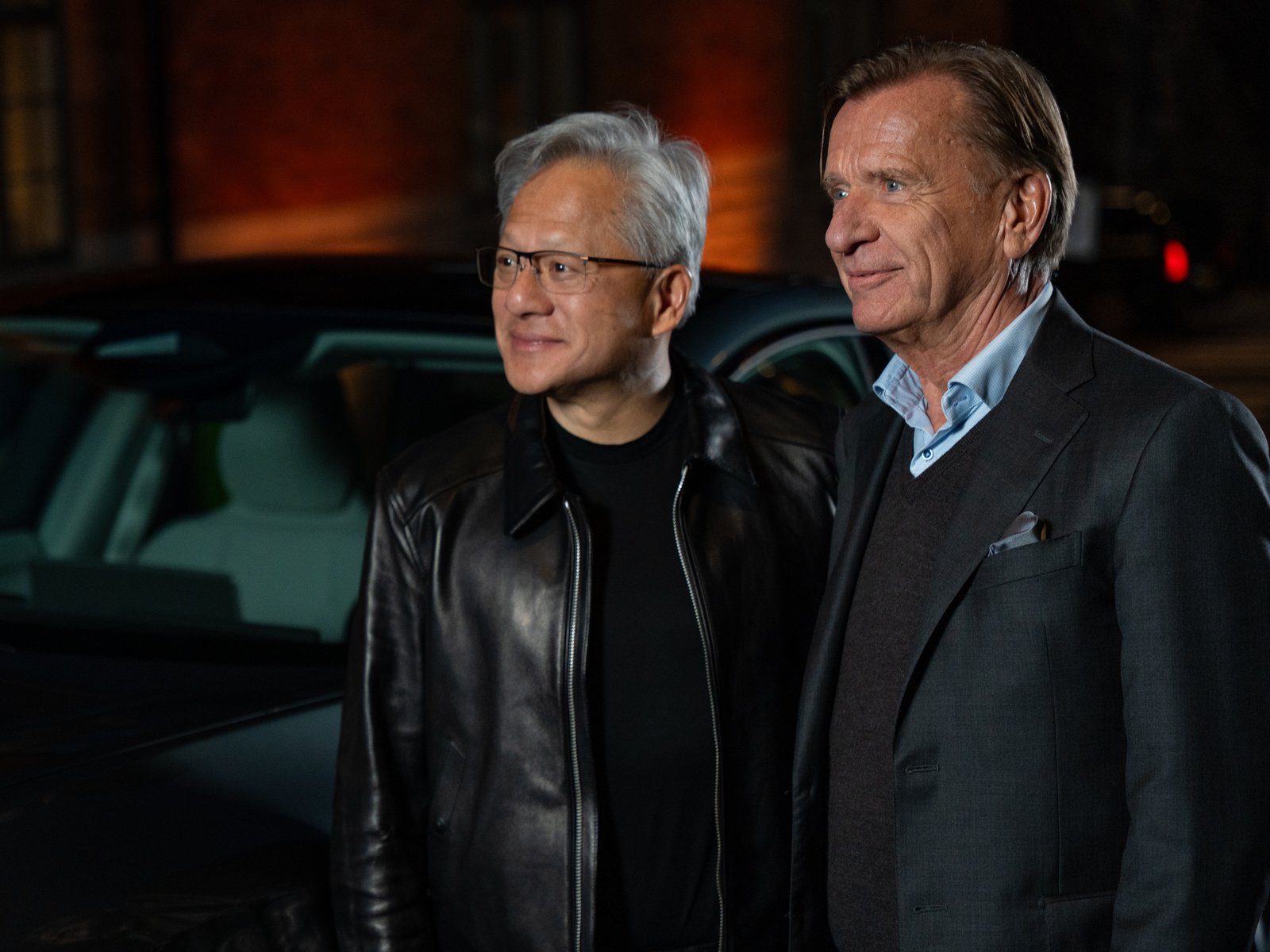Jensen Huang and Håkan Samuelsson standing side by side at night