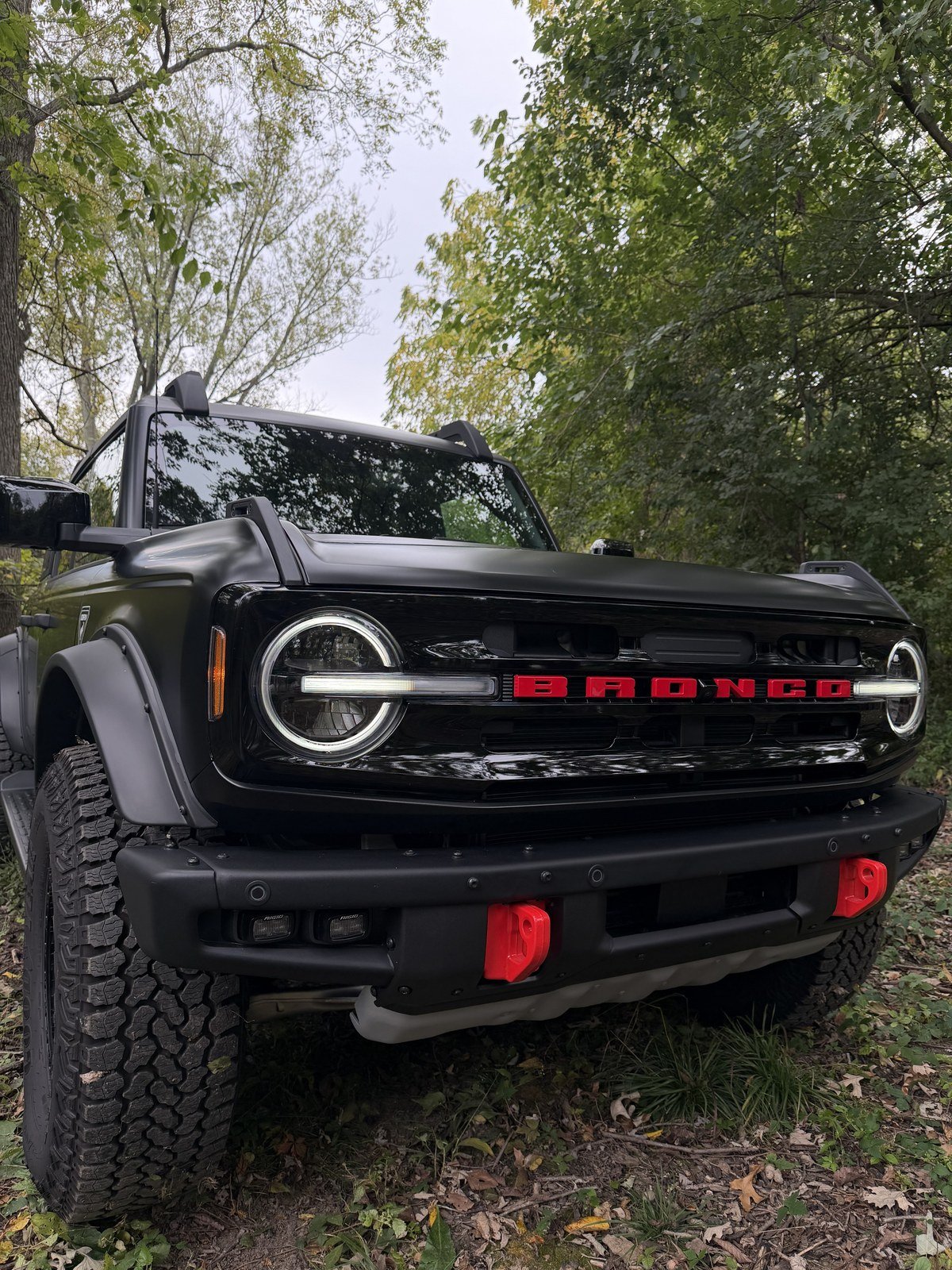 Ford Bronco ORV modular front bumper with red tow hooks and RIGID lights