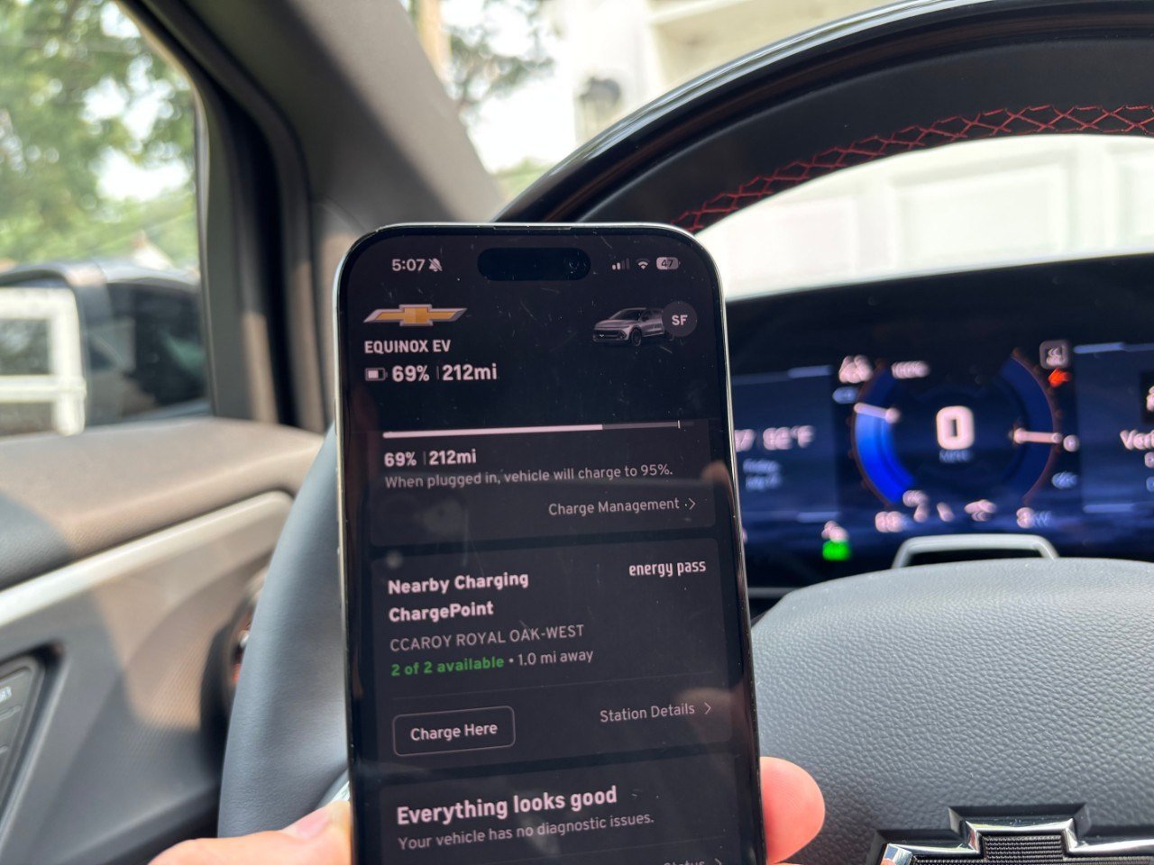 myChevrolet app on a phone inside a Chevrolet Equinox EV