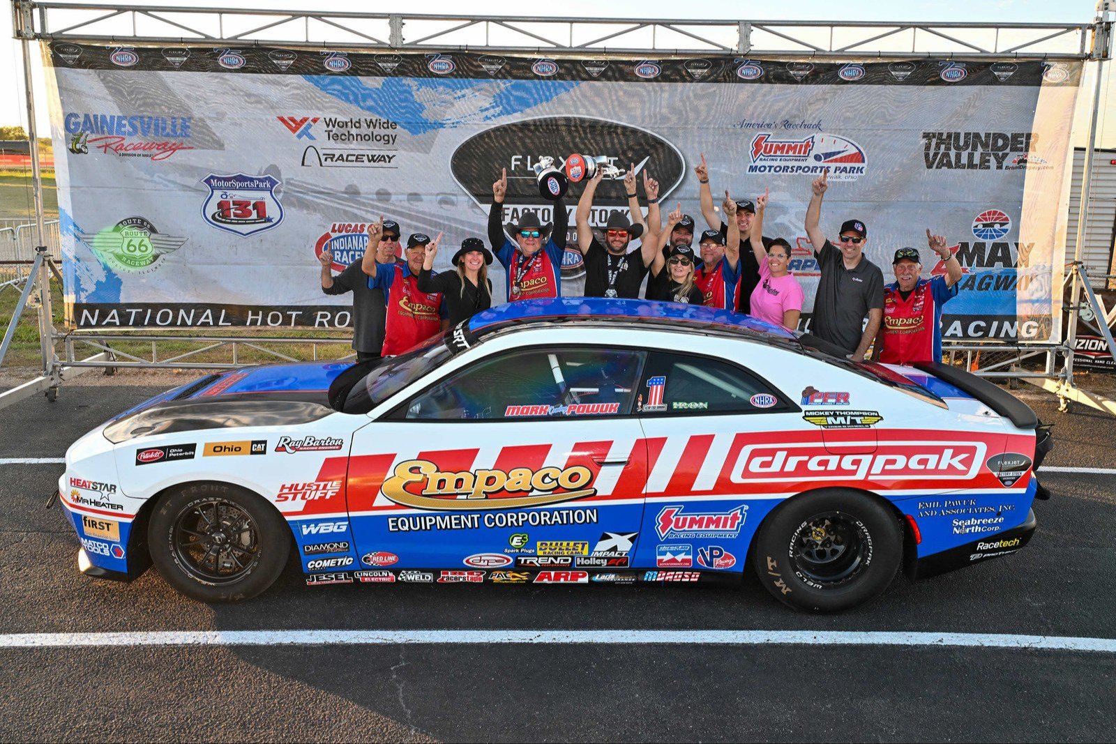 Mark Pawuk's Dodge Charger Drag Pak in the Texas winner's circle