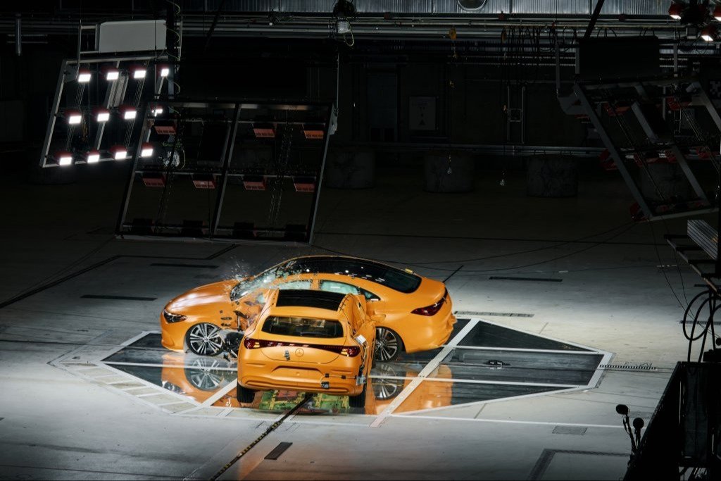 Hybrid CLA striking the side of an electric CLA in a crash hall