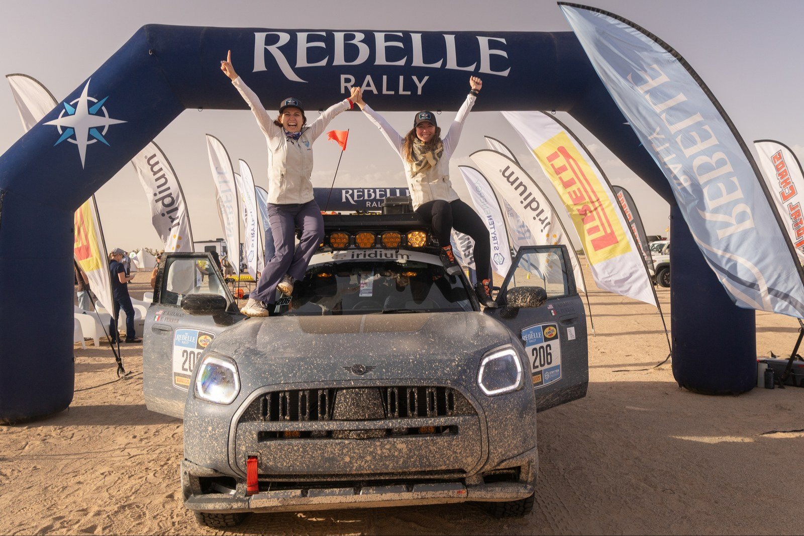 Felicia Killman and Erika Ferrer celebrate on their MINI at the finish