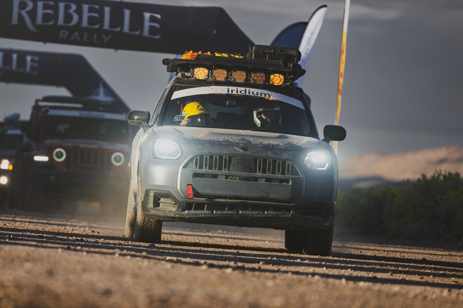 MINI Countryman No. 206 leaving under the Rebelle Rally arch