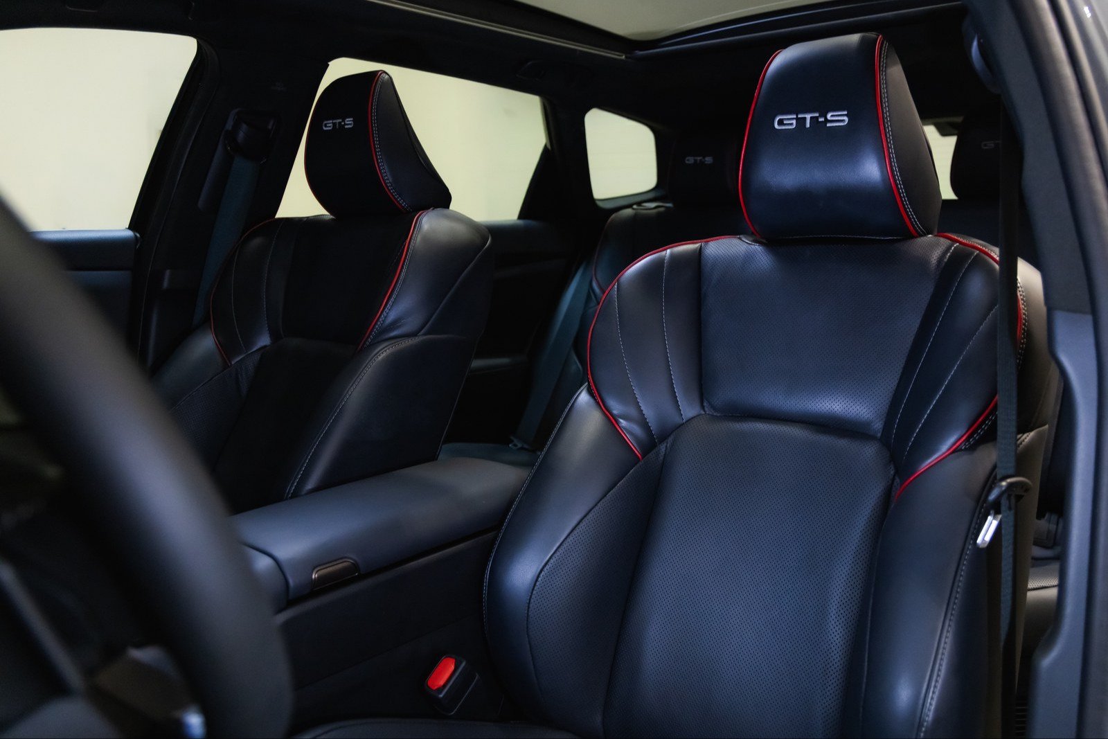 Bolstered black leather front seats with red piping and GT-S headrests
