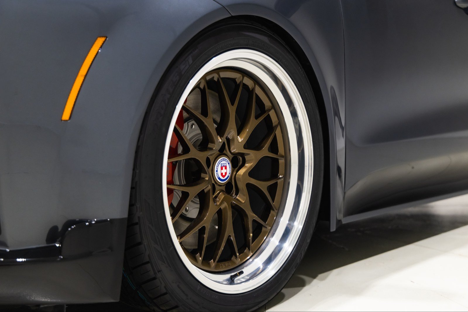 Bronze 21-inch HRE wheel with red caliper on the GT-S concept
