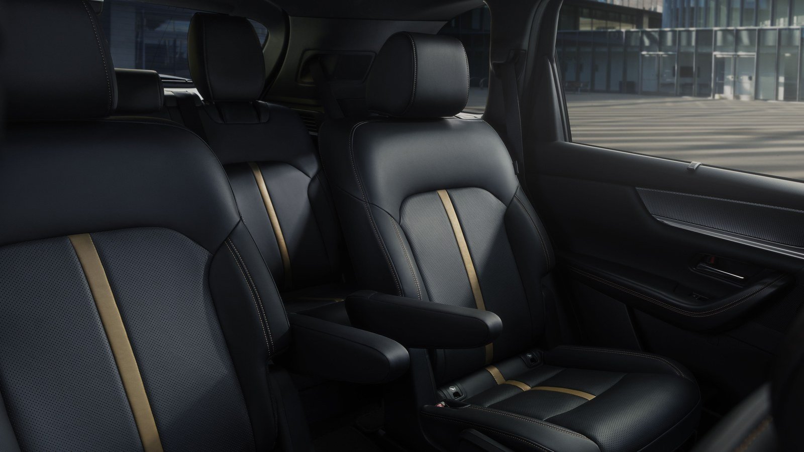 Mazda CX-90 second-row captain's chairs in black and tan leather