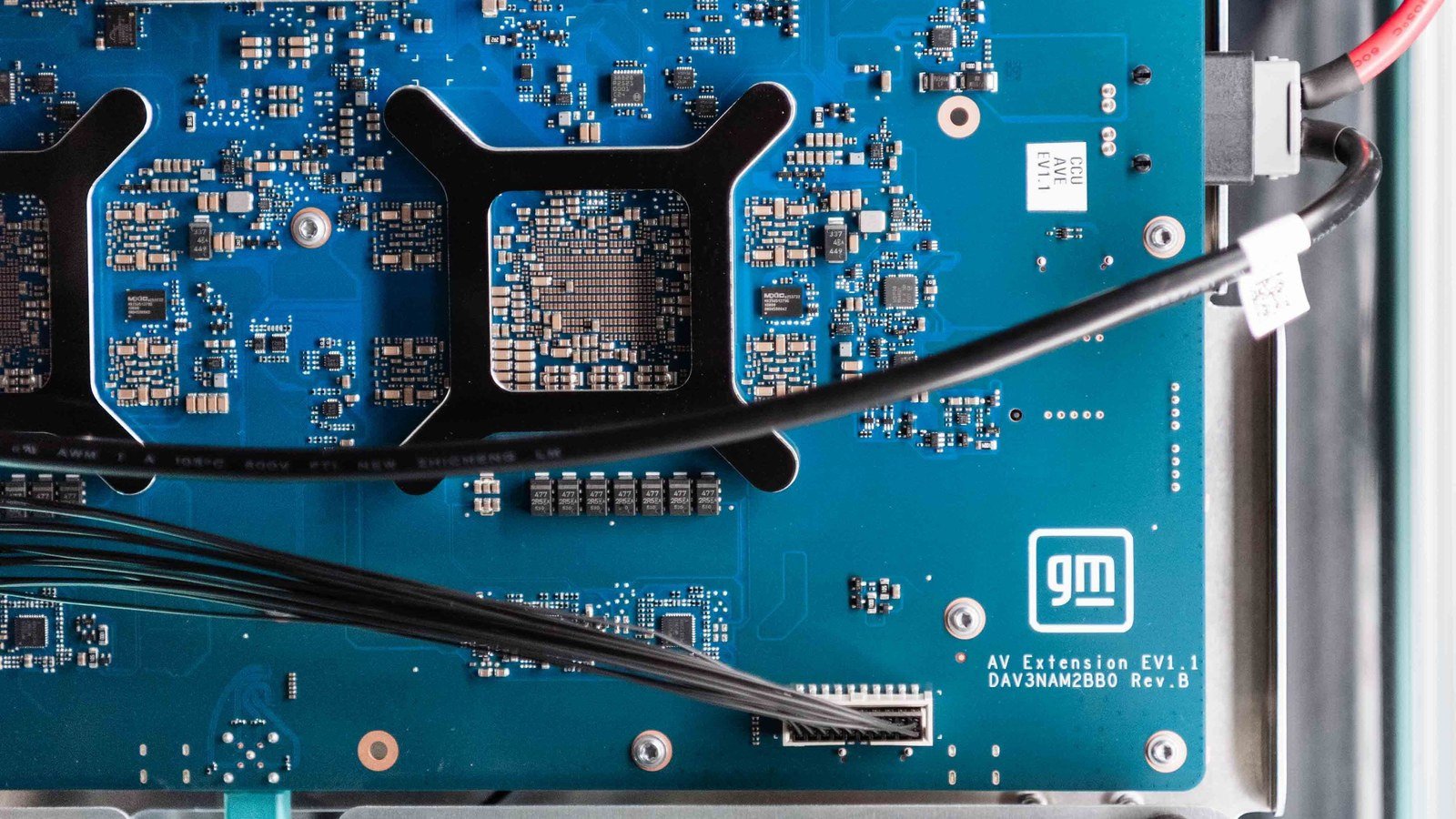 Close-up of a GM-branded circuit board for the Central Compute Unit