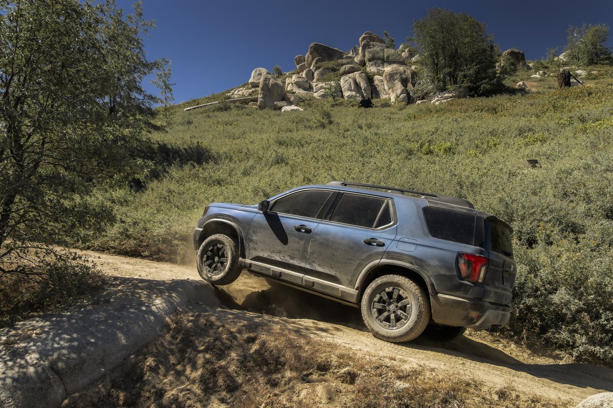 Honda Passport TrailSport climbing a rocky dirt trail