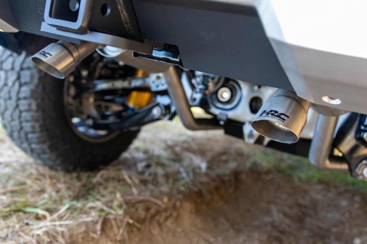 HRC-branded exhaust tips under the rear of a Honda SUV