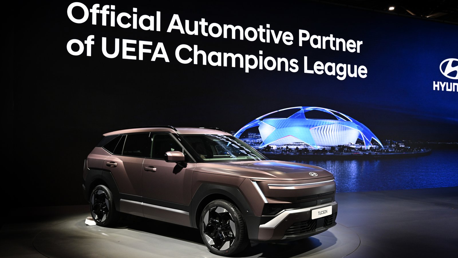 All-new Hyundai Tucson beside the UEFA Champions League trophy display in Paris