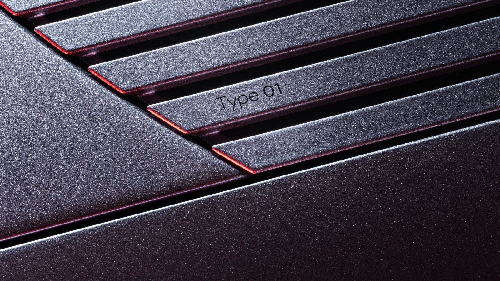 Type 01 badge on the Jaguar strikethrough graphic