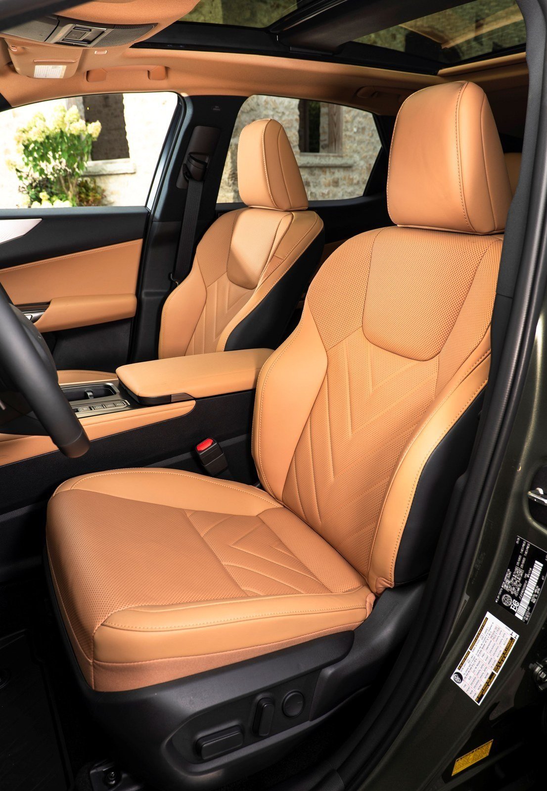 Tan leather front seats of the 2027 Lexus NX 450h+ Luxury