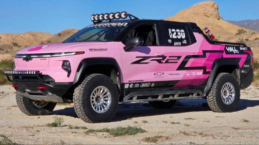 Pink Chevrolet Silverado EV ZR2 race truck in the desert