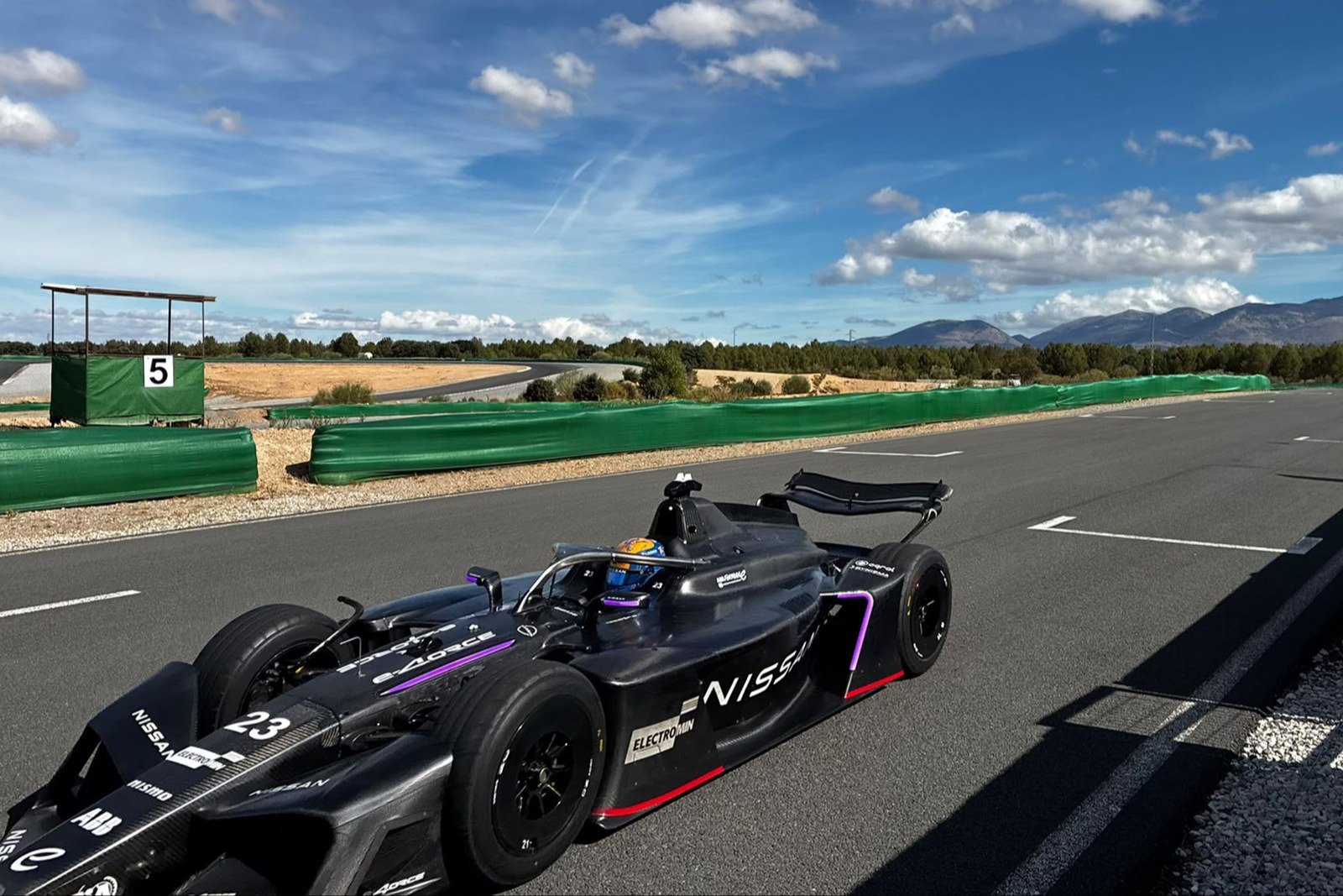 Nissan GEN4 Formula E car No. 23 on the pit straight