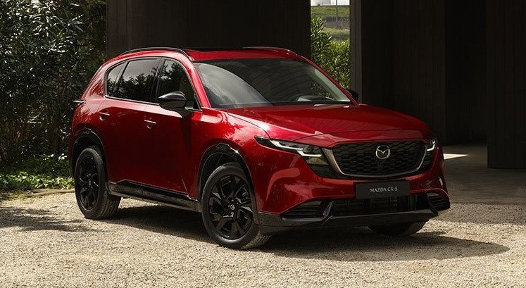 Soul Red Crystal Mazda CX-5 front three-quarter view outside a house