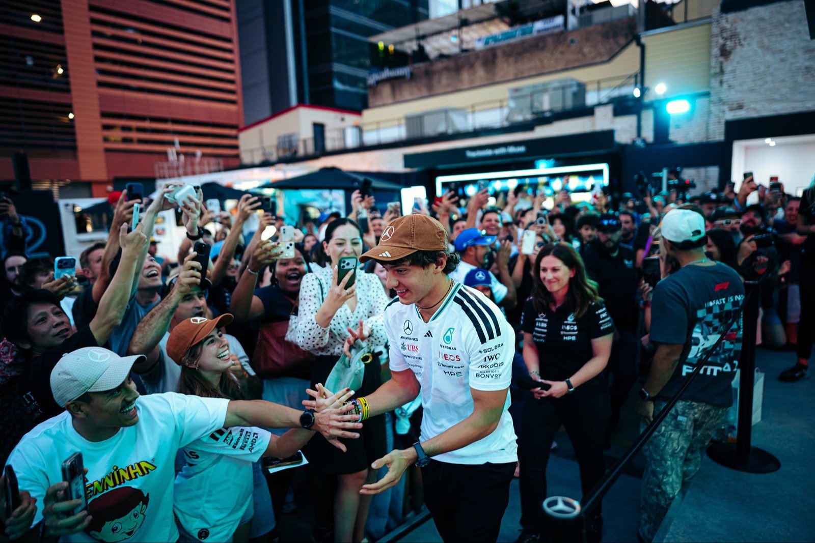 Mercedes F1 driver greeting cheering fans at the Austin hub
