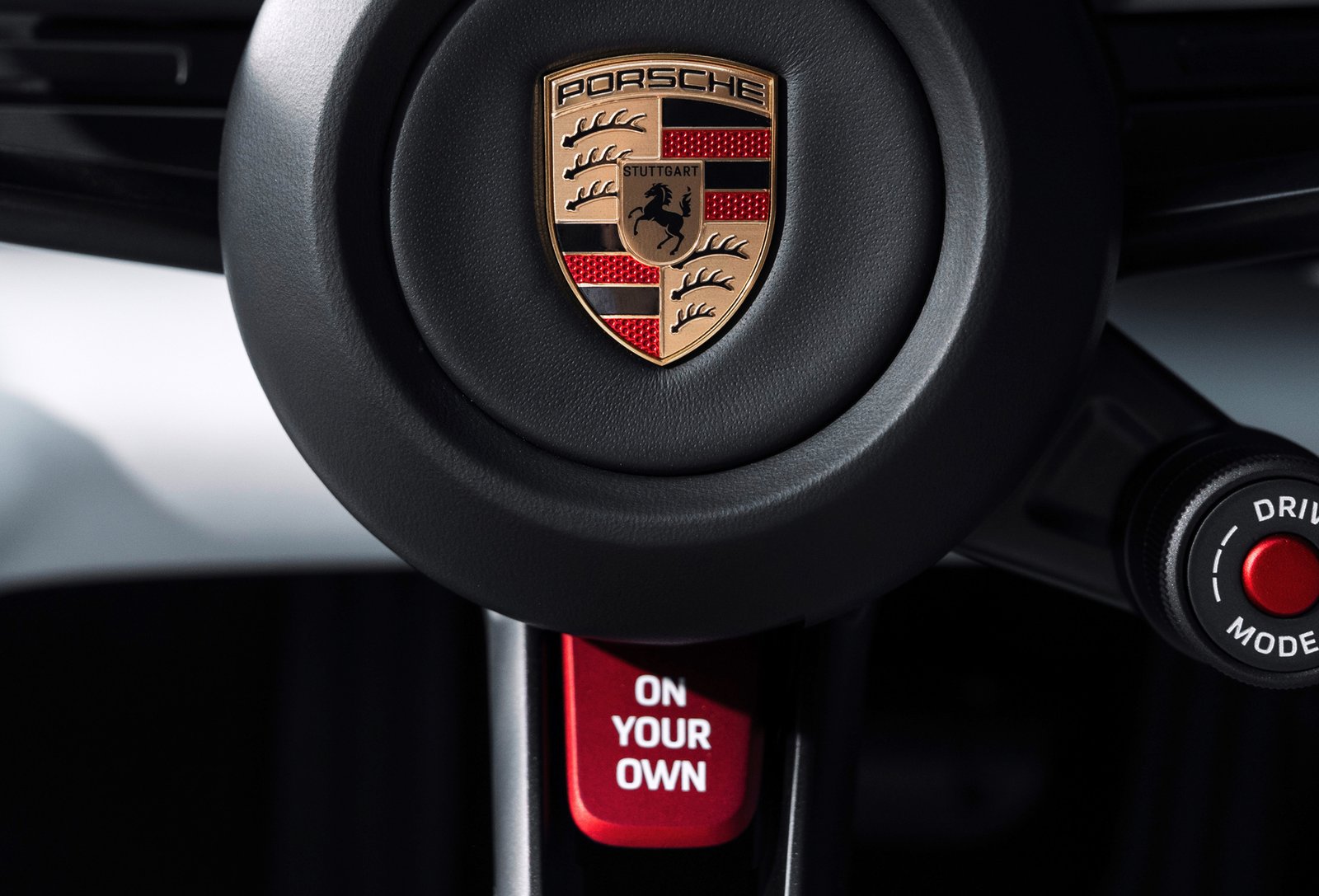 Red On Your Own button on Porsche Mission S steering wheel