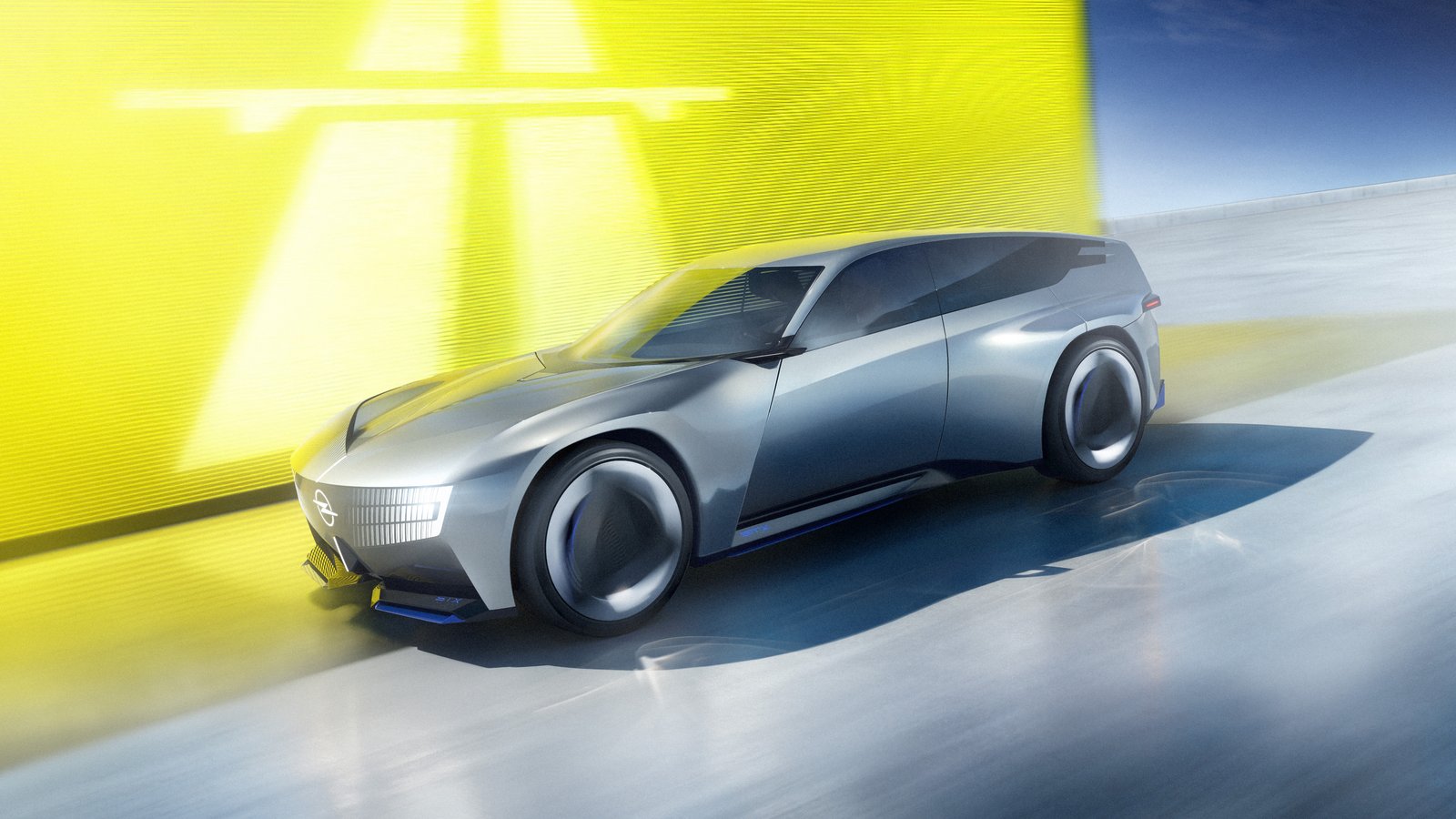 Opel STX Concept driving past a yellow wall, front three-quarter view