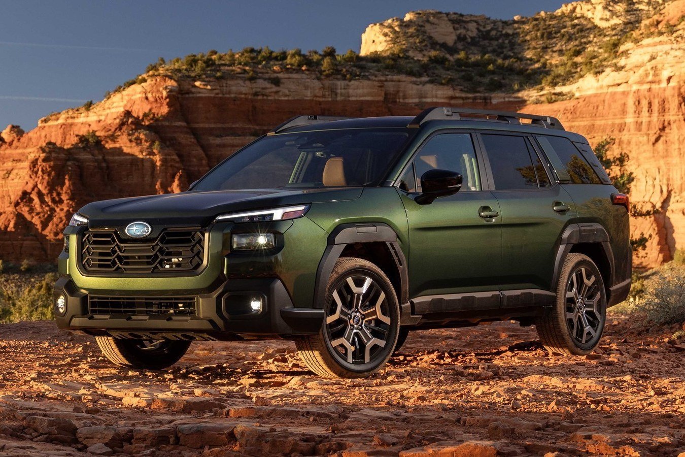 Green 2027 Subaru Outback Wilderness on red rock