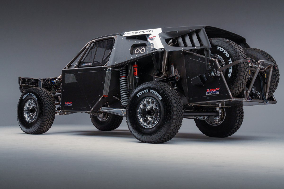 Rear three-quarter view of the unpainted Passport Baja Spec