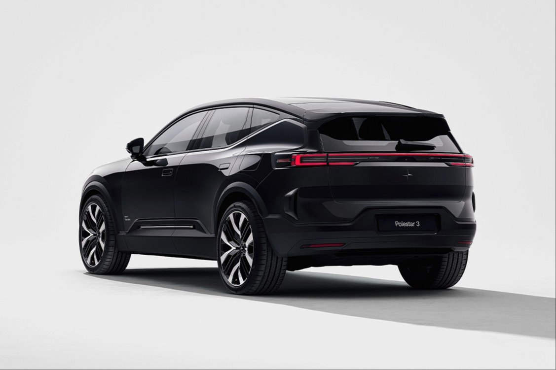 Black Polestar 3 SUV in a studio, rear three-quarter view