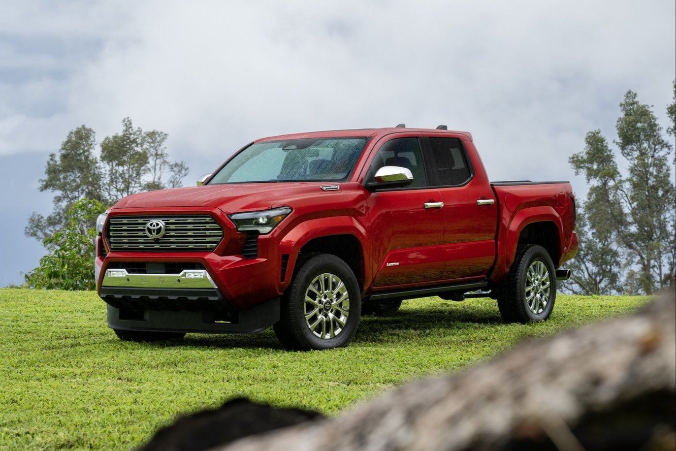 Red 2026 Toyota Tacoma Limited parked on grass