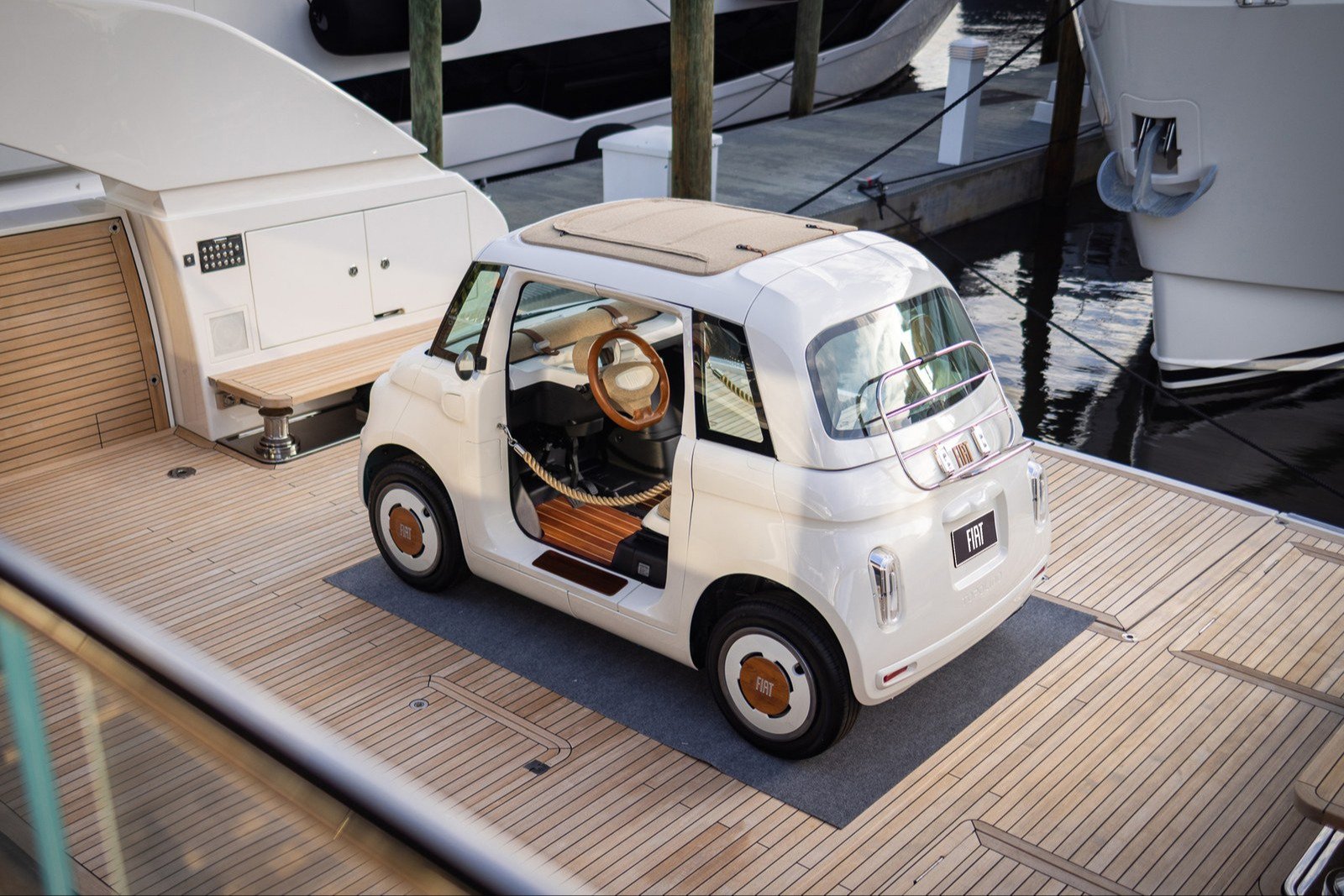 White one-off Fiat Topolino on the deck of a Sanlorenzo yacht