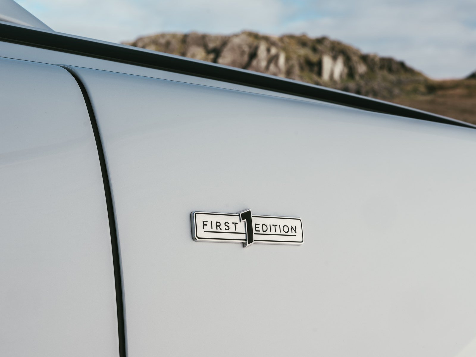 First Edition badge on the front fender of a white Torcal